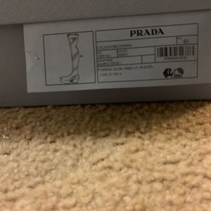 Black Prada over the knee leather boots.